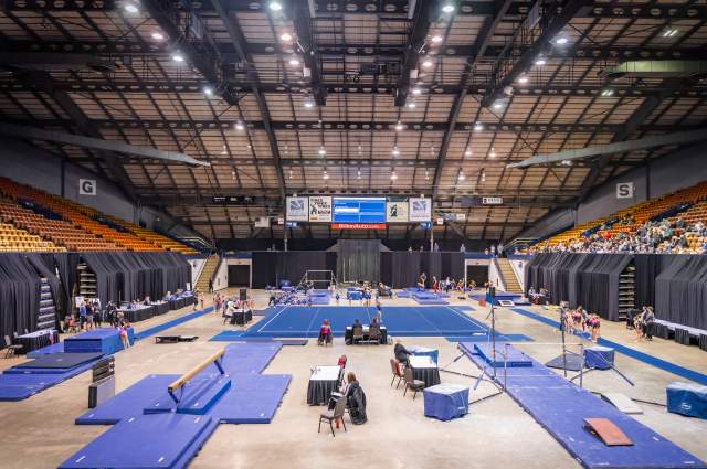 Arena floor set up with mats for a gymnastics competition