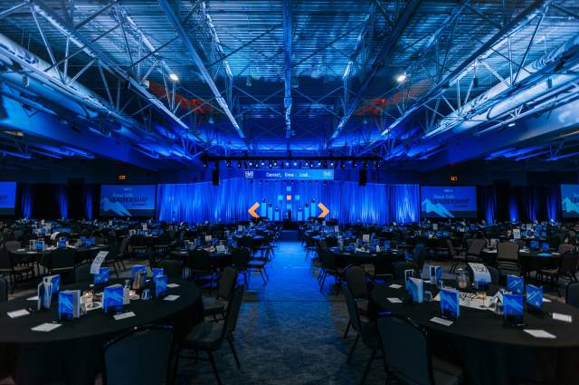 Front Facing Conference Stage with Pre-Set Attendee Tables