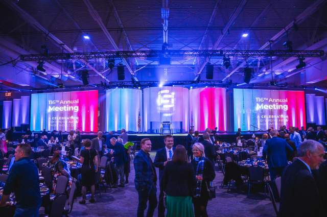 Full Exhibit Hall with Long Stage and Lighting for Experience Sioux Falls Annual Meeting