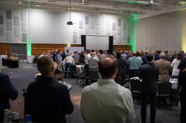 Grand Ballroom Set Up with a Projector Screen for a Company Training Presentation