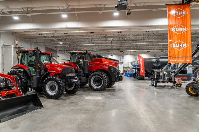 Exhibit Halls with Multiple Large Pieces of Farm Equipment for a Trade Show