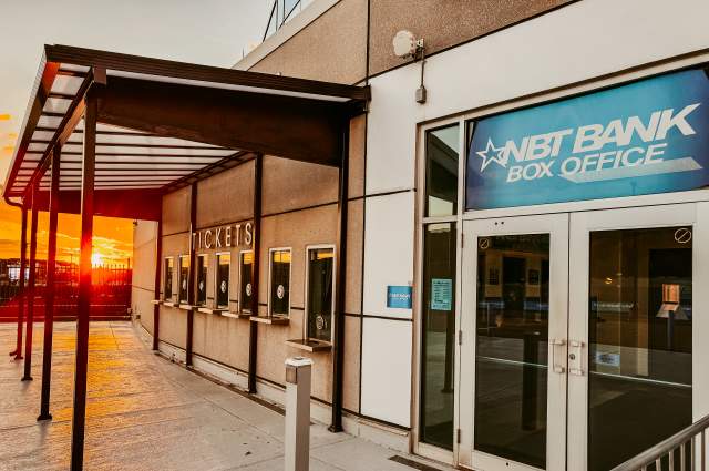 The NBT Bank Box Office at the Mohegan Arena at Casey Plaza during sunset