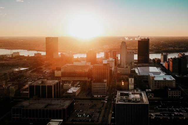 Photo of downtown Toledo with a sunset.