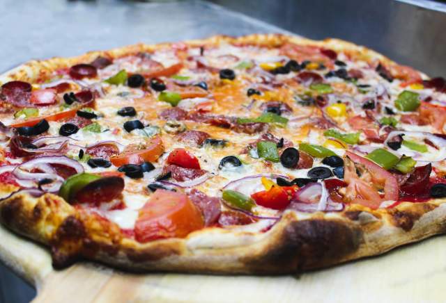 Experience the bold flavors of Buffalo, NY, with every slice at Capo's Pizzeria
