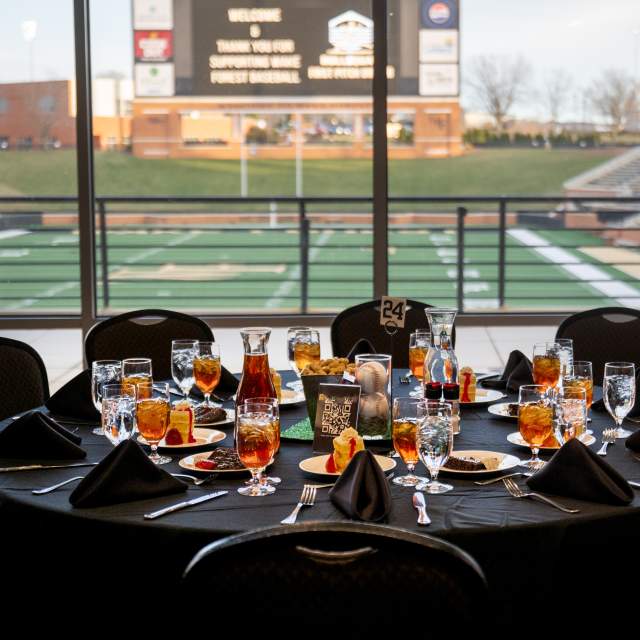 A table setting with drinks and desserts