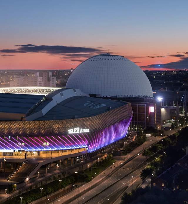 Arena lit up at sunset