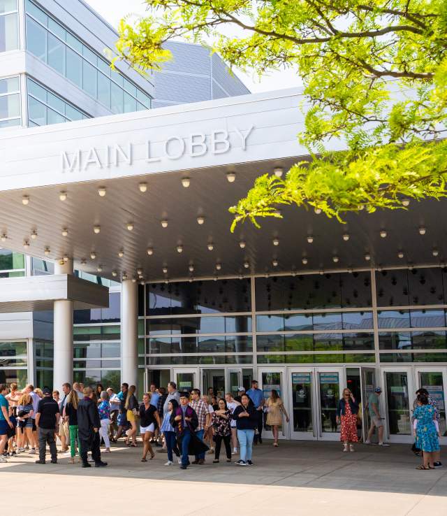 Attendees for an event waiting outside of the main lobby entrance to Denny Sanford Premier Center