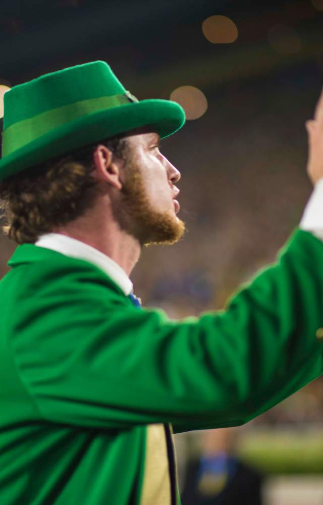 The Notre Dame Leprechaun cheering for the football team