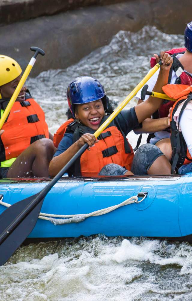 A kayak of four people go down the East Race Waterway in downtown South Bend