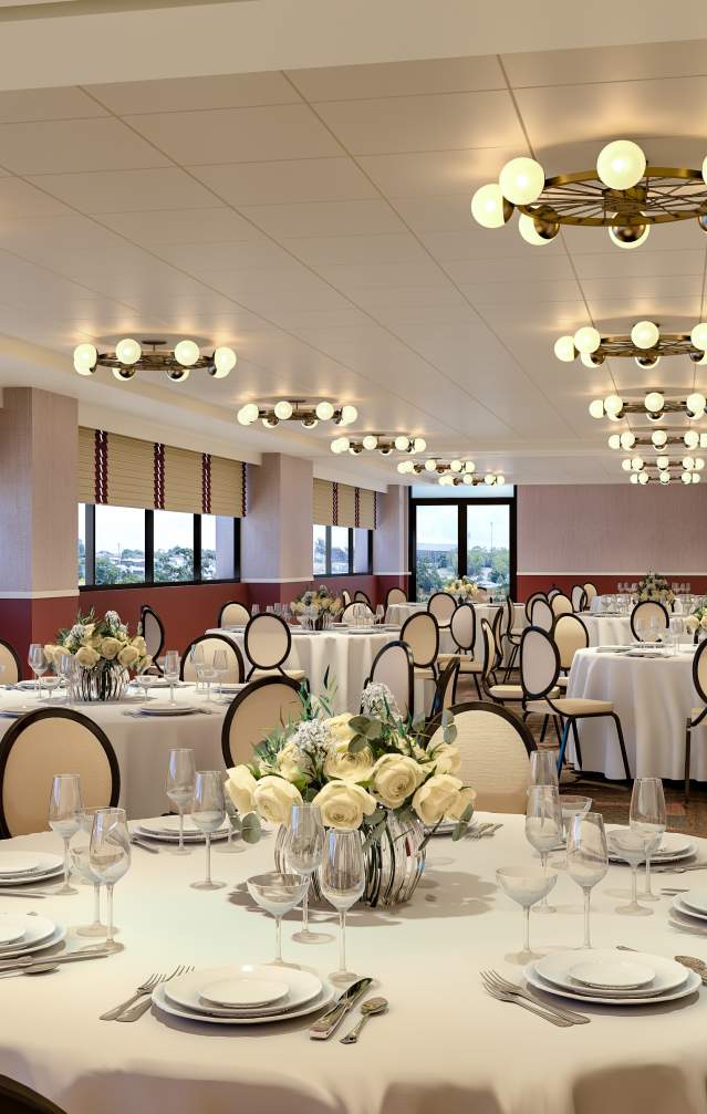 A meeting space at the Graduate Hotel set up for a large group dinner