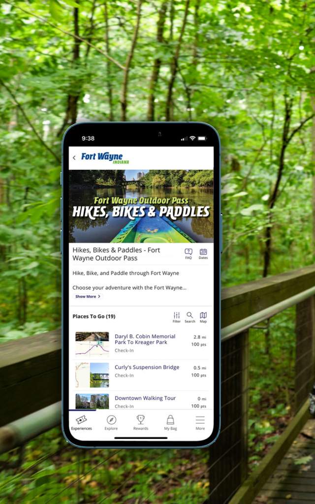 Fort Wayne Outdoor Pass on phone with a family hiking in the background.