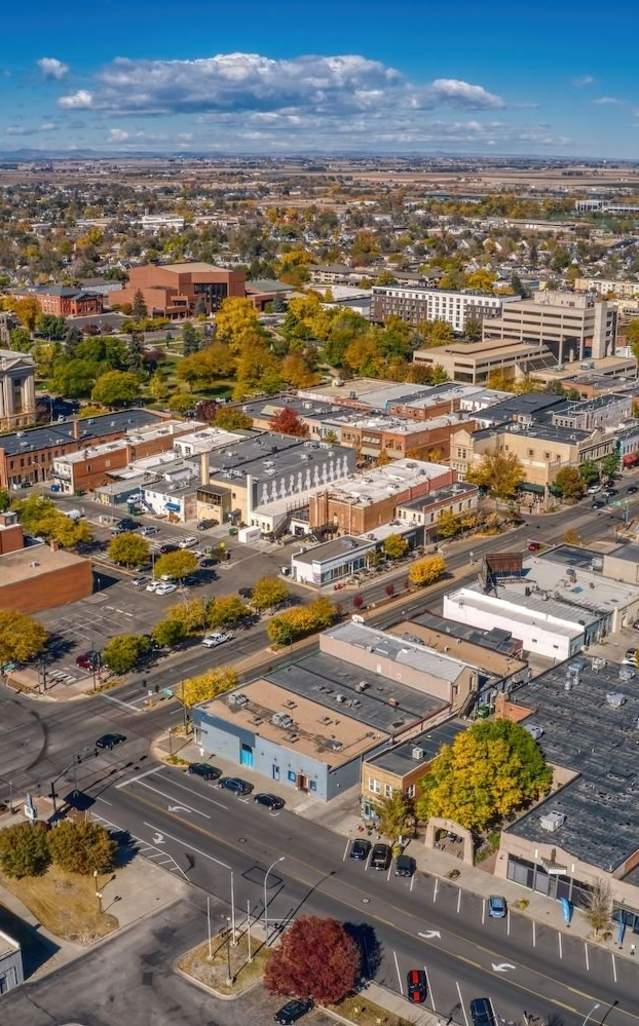 Aerial Drone View of Downtown Greeley with Mountains in Background