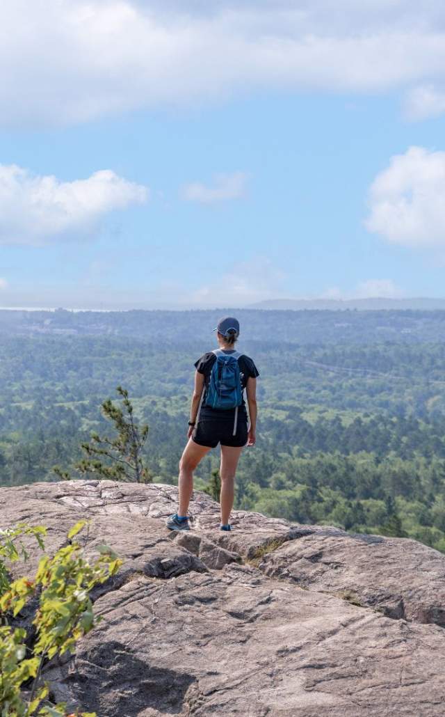 A hiker at Sugarloaf Mountain, Marquette, located in the Upper Peninsula of Michigan