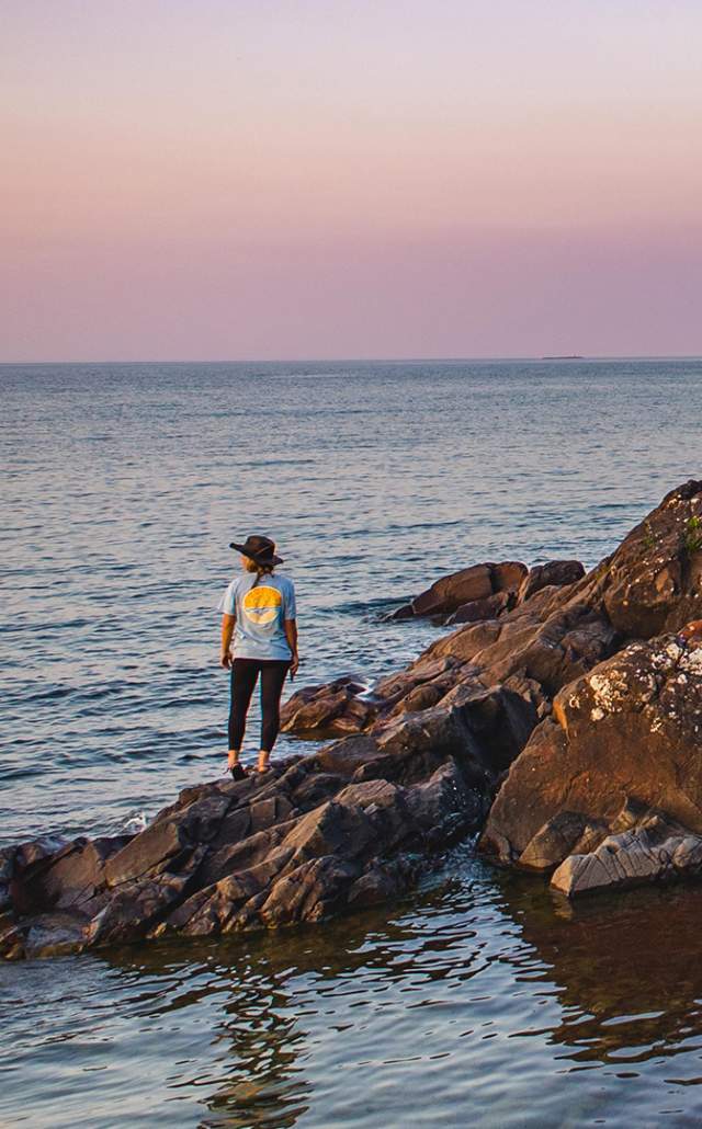 A rocky beach at sunset in Copper Harbor, located in the Upper Peninsula of Michigan