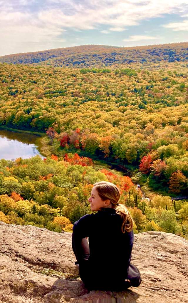 A woman overlooking Lake of the Clouds during fall color in the Upper Peninsula