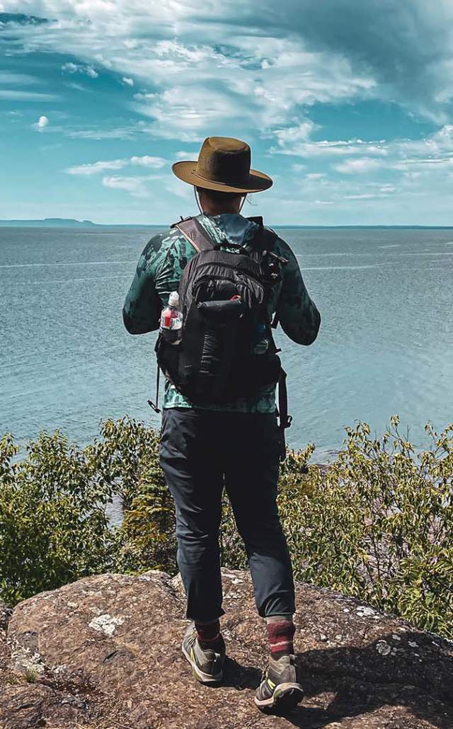 Hiker at an overlook at Isle Royale National Park, located in the Upper Peninsula of Michigan