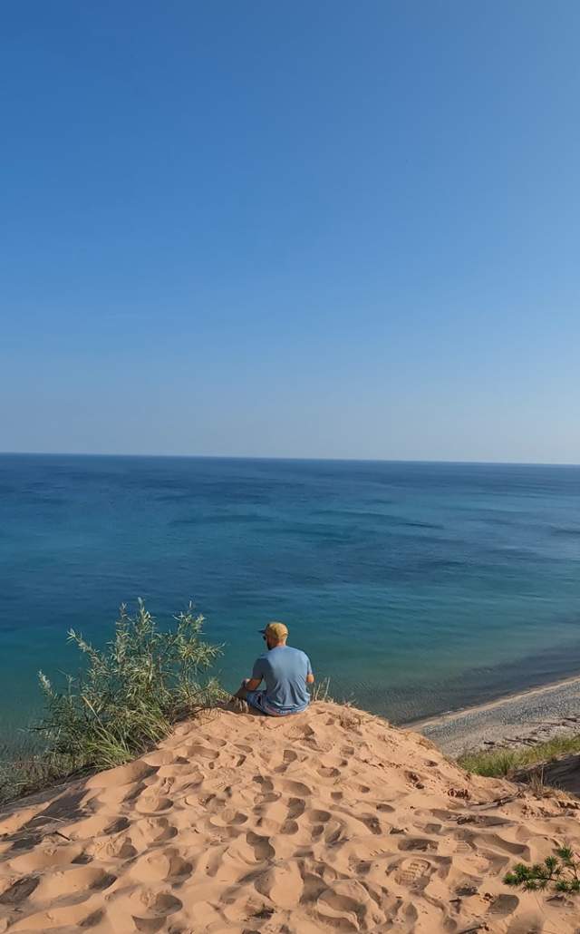A man lookout out at Lake Superior at Pictured Rocks National Lakeshore in the Upper Peninsula of Michigan