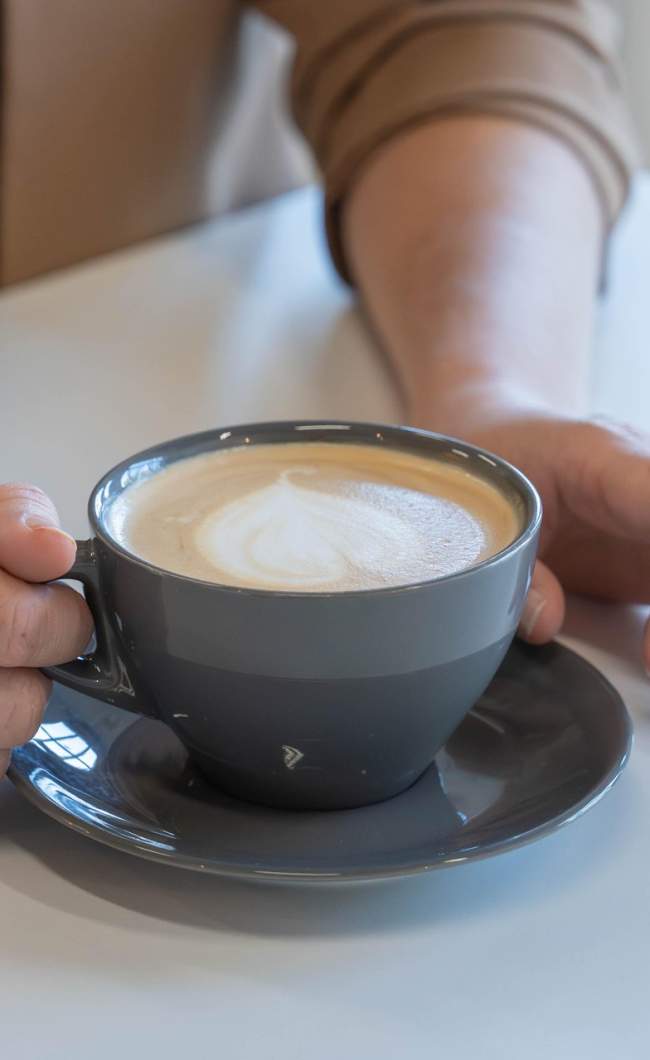 Hands holding a coffee