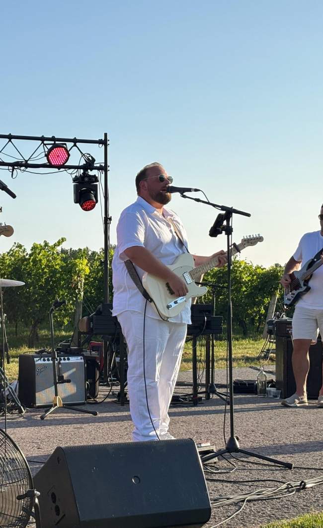 Performers in a vineyard