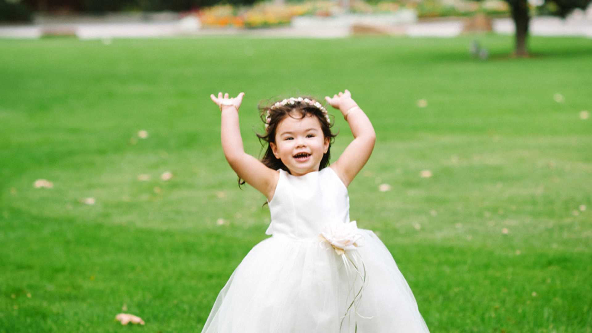 Wedding flower girl throws bouquet