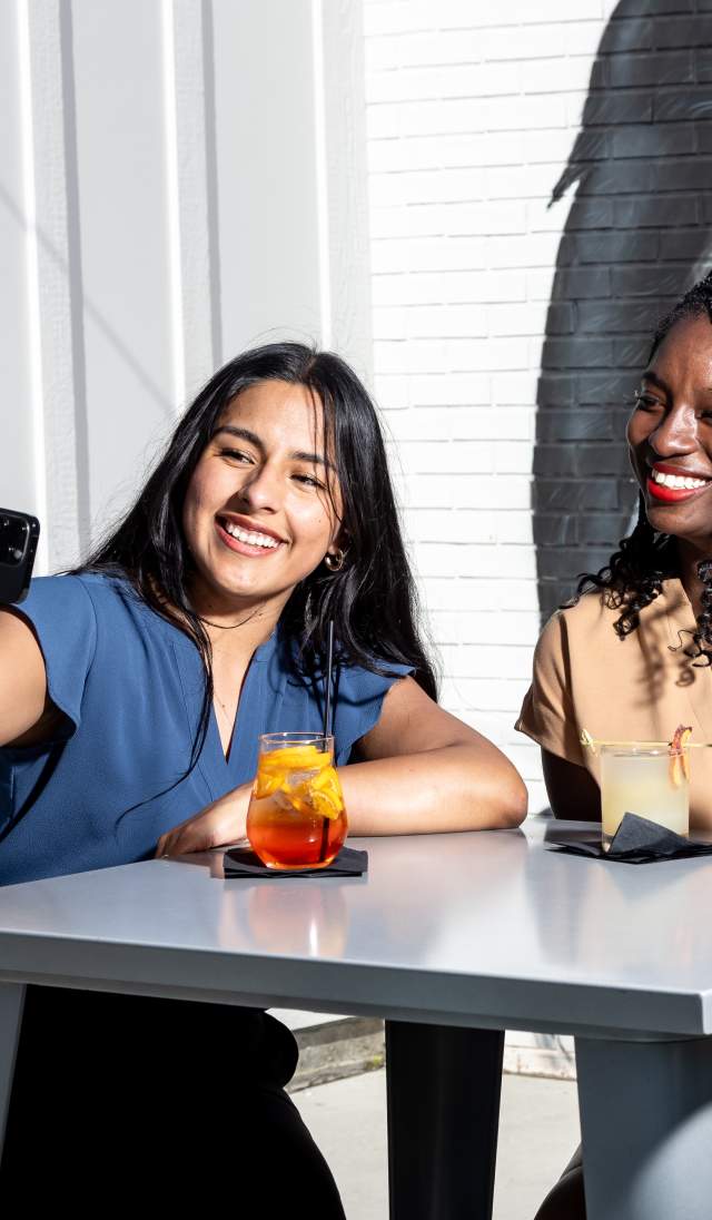 Two women taking a selfie of them enjoying cocktails at Haymount Truck Stop