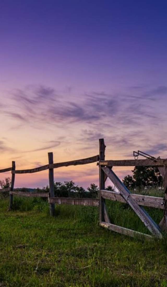 Image of old house fence at dusk