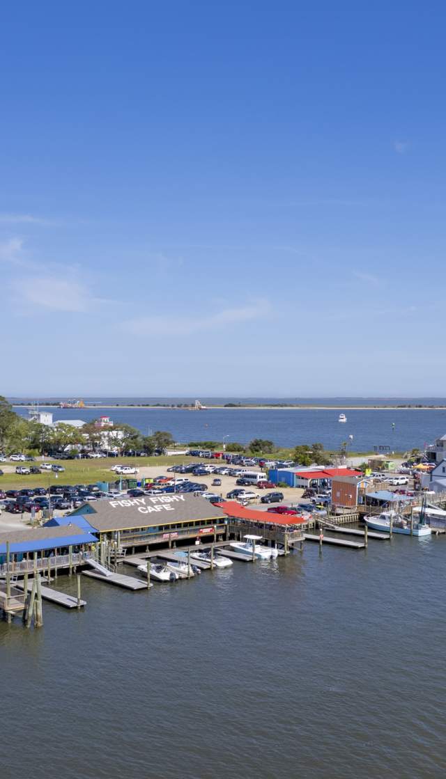 aerial view of a town with restaurants and boat slips
