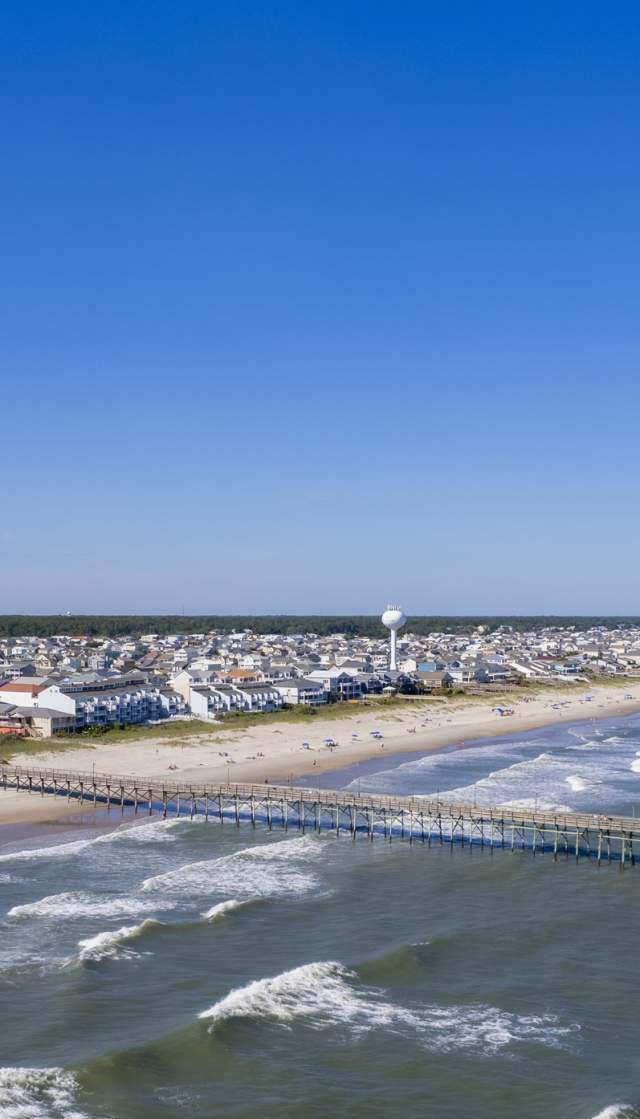 aerial view of a beach and pier
