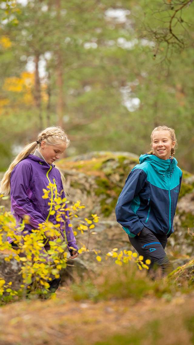 Two girls on a hike or walking tour in the forest near Børtevann in Østfold.