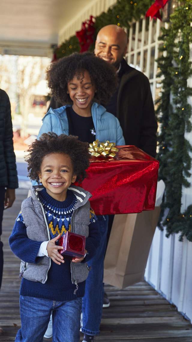 Family with Christmas presents