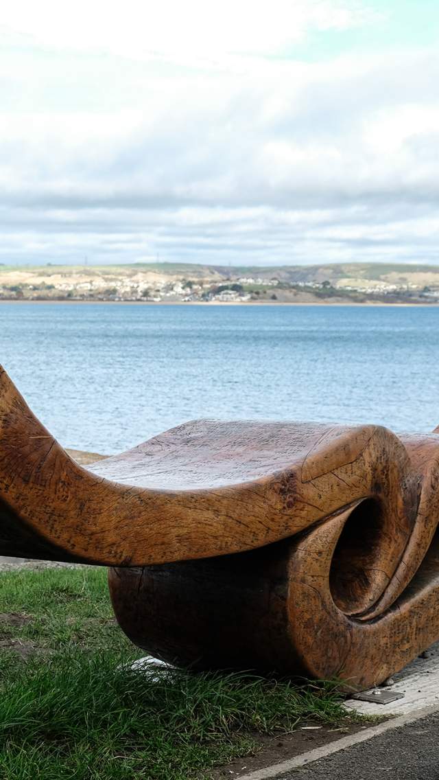 Time and Tide is a sculptural bench made from a single huge slab of oak.