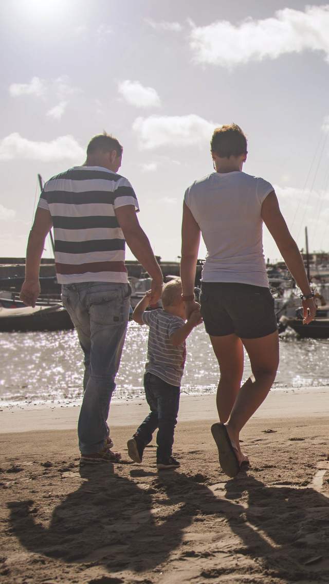 Family on the beach Lyme Regis