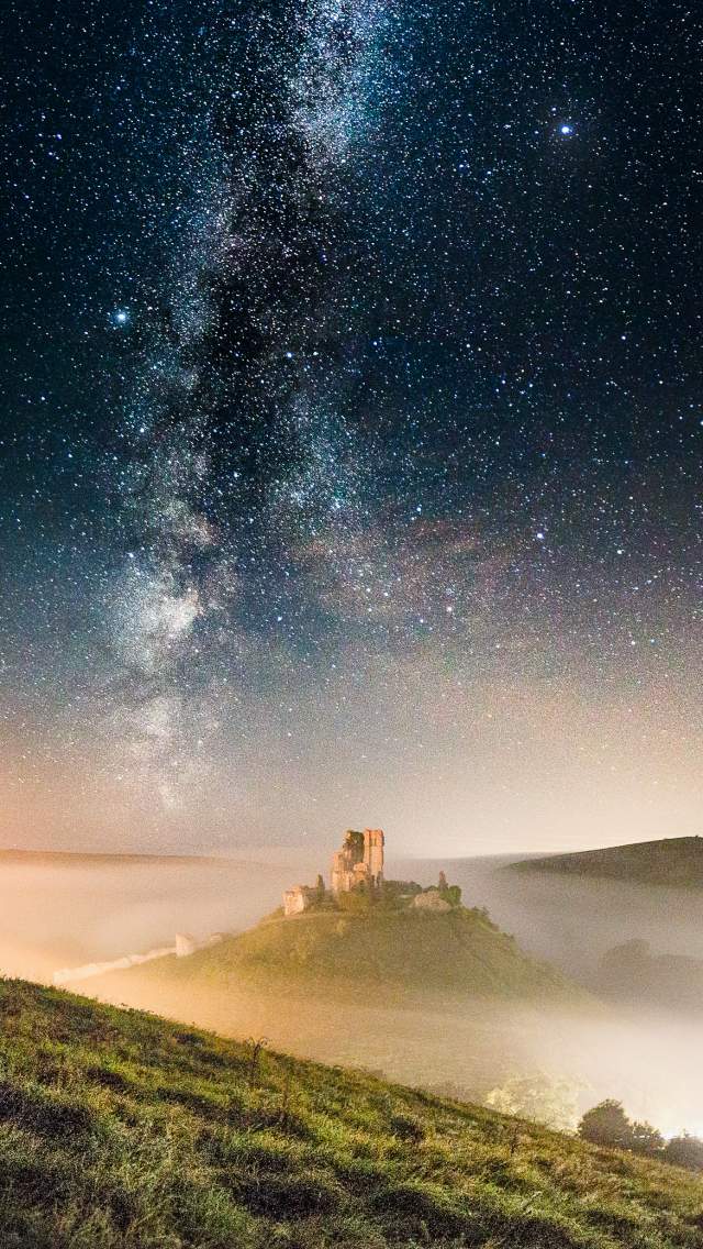 Corfe Castle in the mist and the Milky Way