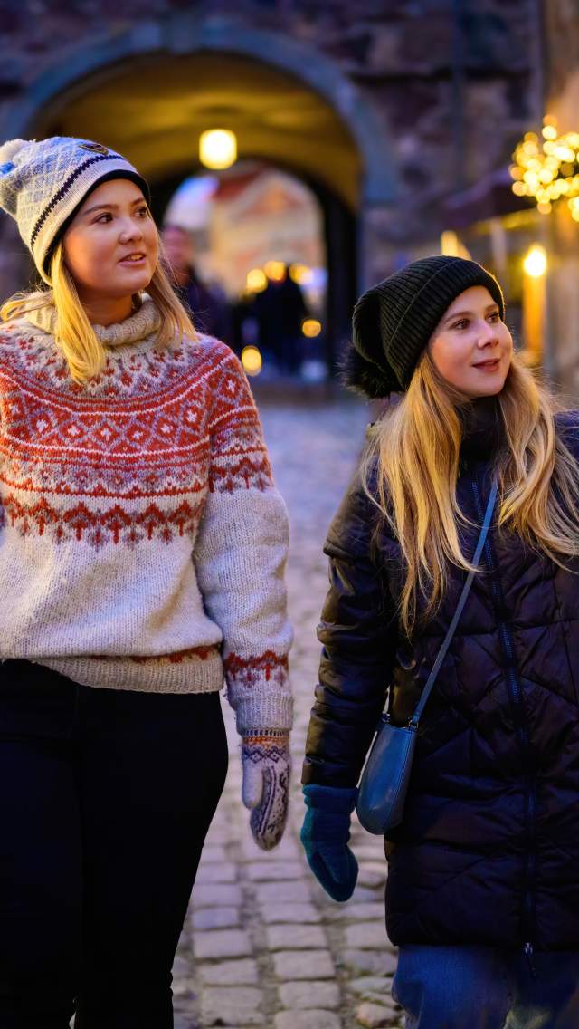 Two girls visiting the christmas market at Fredriksten Fortress in Halden.