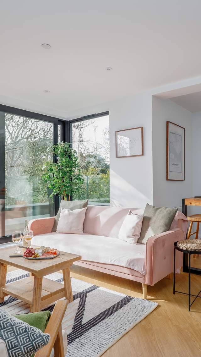 The light, spacious and modern lounge at Grandeur Property's Aurora Penthouse in Poole, Dorset