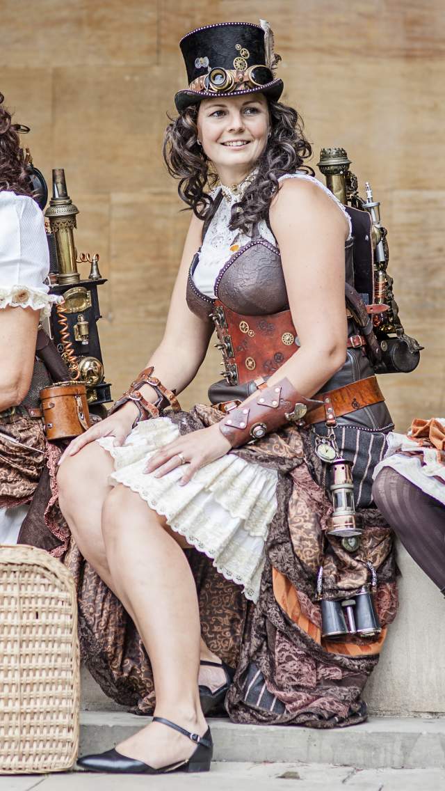 Three women dressed in Steampunk costumes, for the Lincoln Steampunk Festival