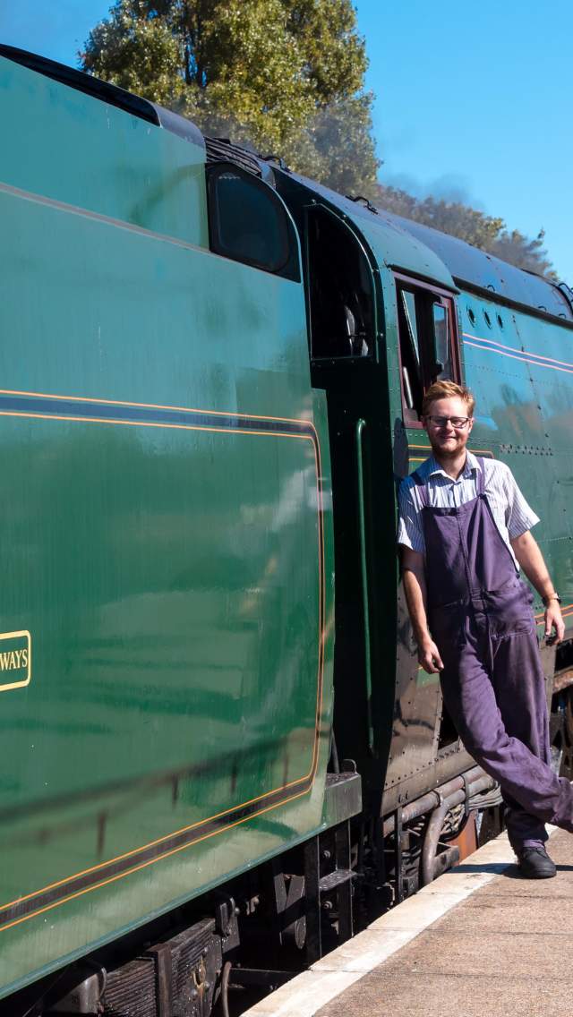 Swanage Railway train drive leaving up against a train at Swanage Station in Dorset