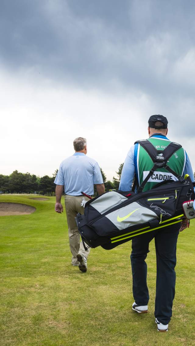 Golfer and Caddy