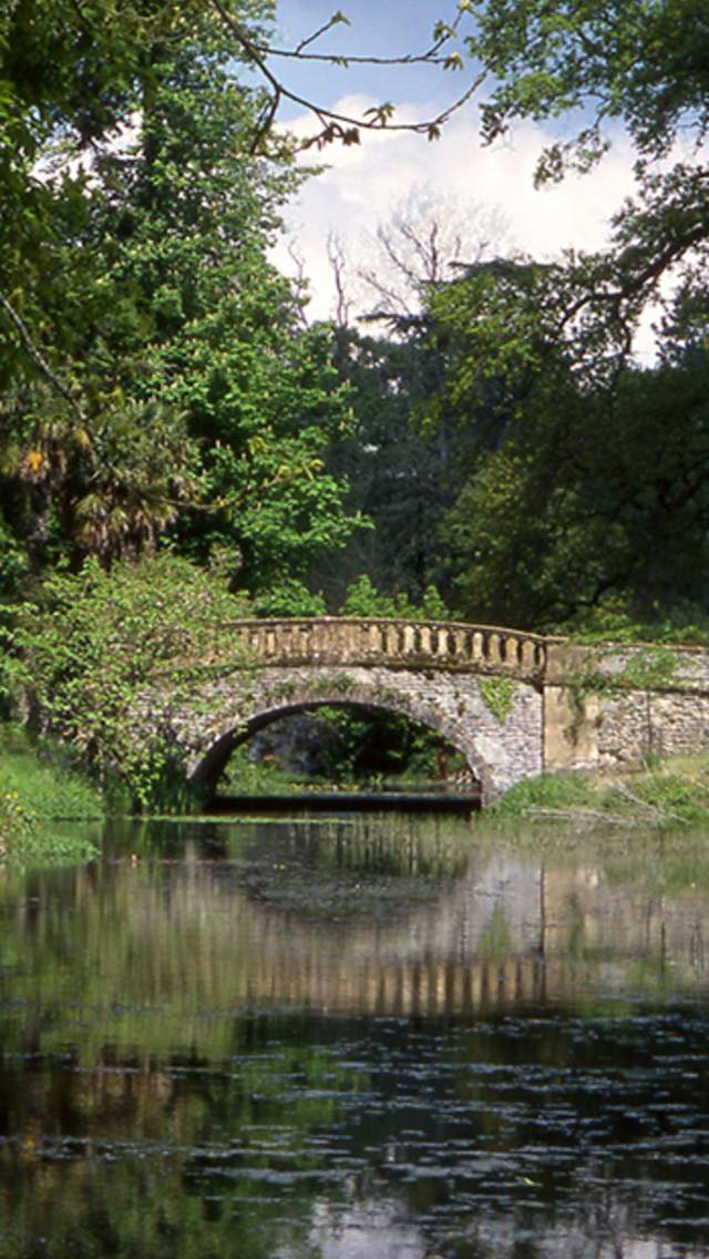 Bridge over water at Minterne House & Gardens