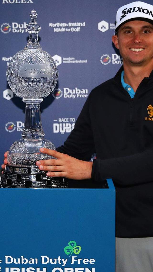 Golfer John Catlin holding the Waterford Crystal trophy of the Dubai Duty Free Irish Open after winning the 2020 tournament.