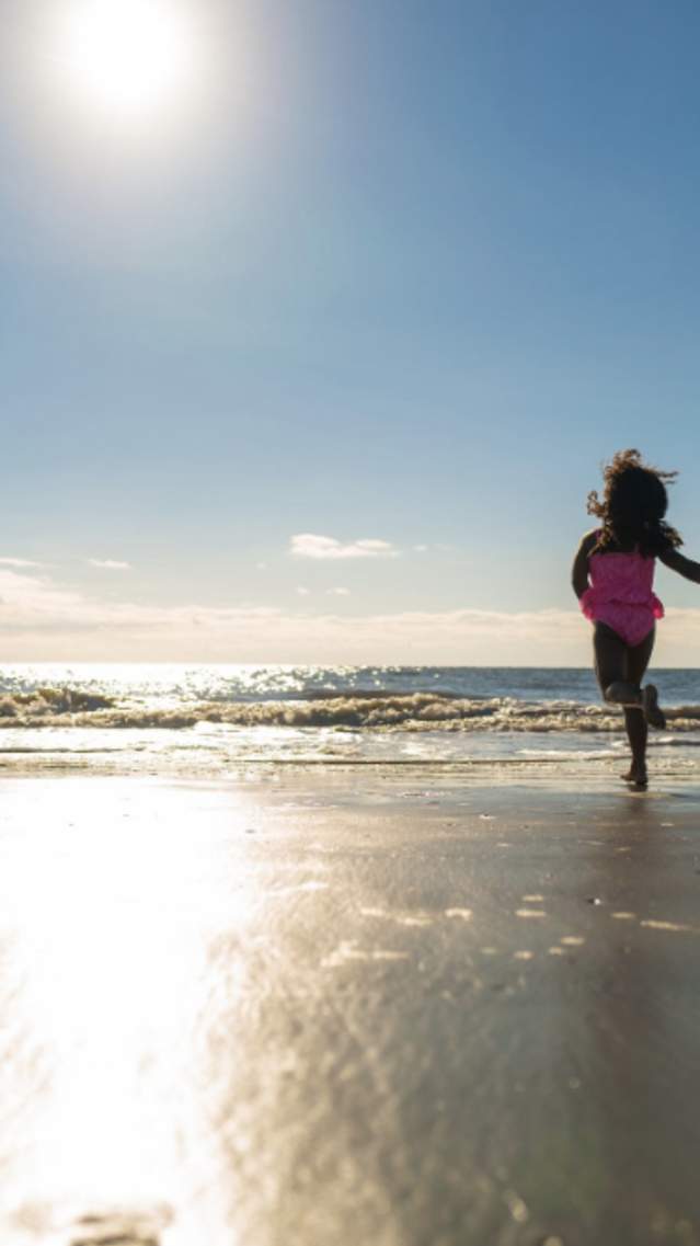Kids running on the beach