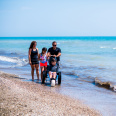 family of 4, son in wheelchair on Bradford Beach