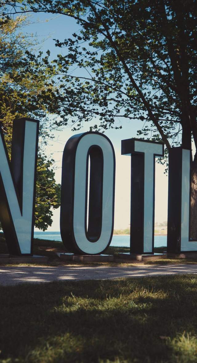 LED "NOTL" letters displayed in a waterfront park