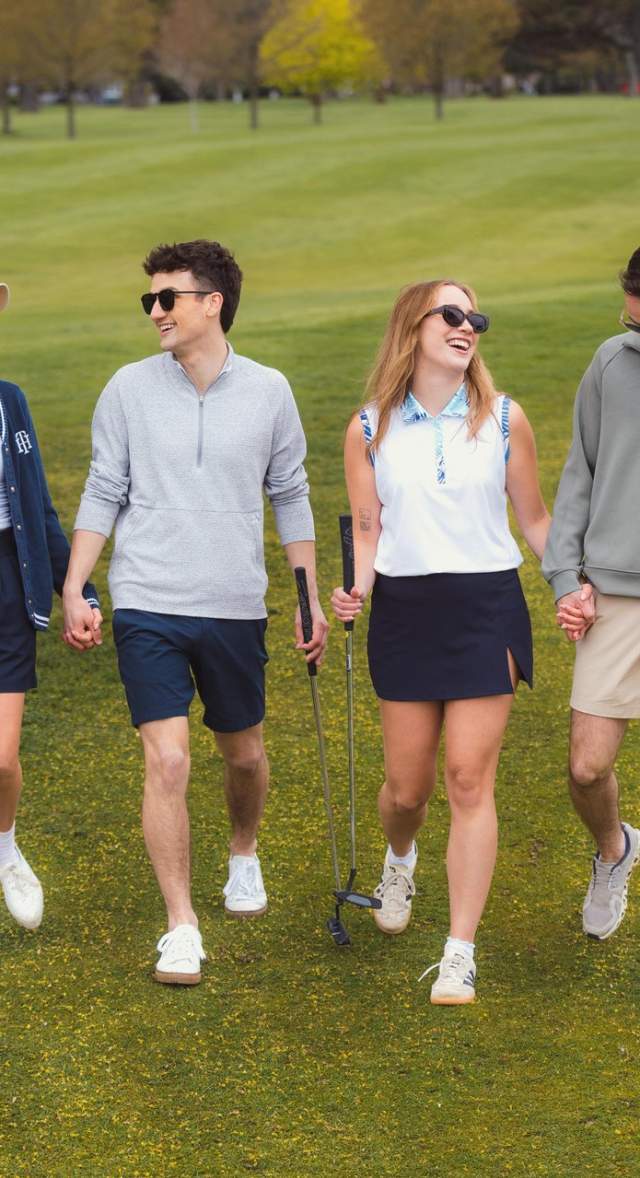 Golfers smiling on green