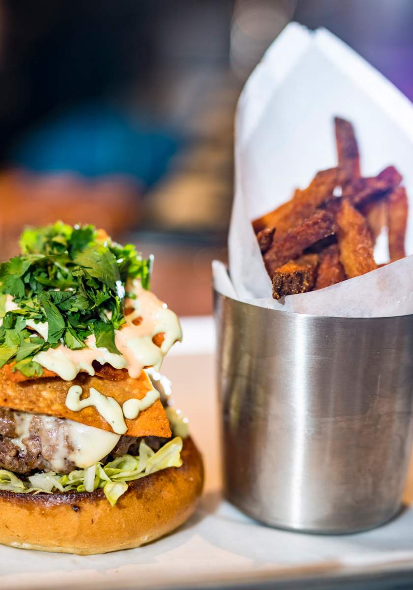 A Cheeseburger with a side of sweet potato fries from Farmer & the Cow.