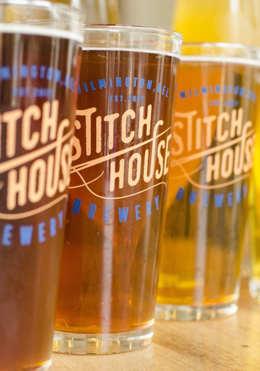 Stitch House Brewery beers in assorted amber and golden hues.