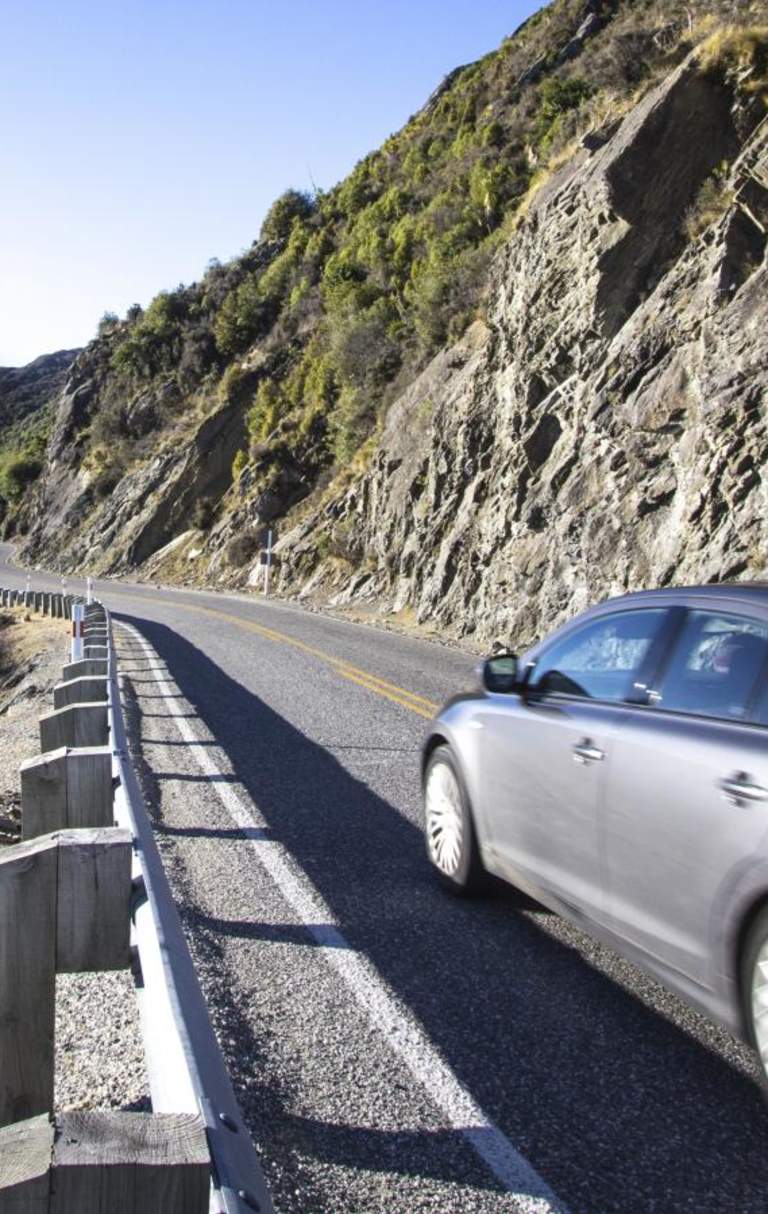 Car driving along the Devils Staircase from Kingston to Queenstown