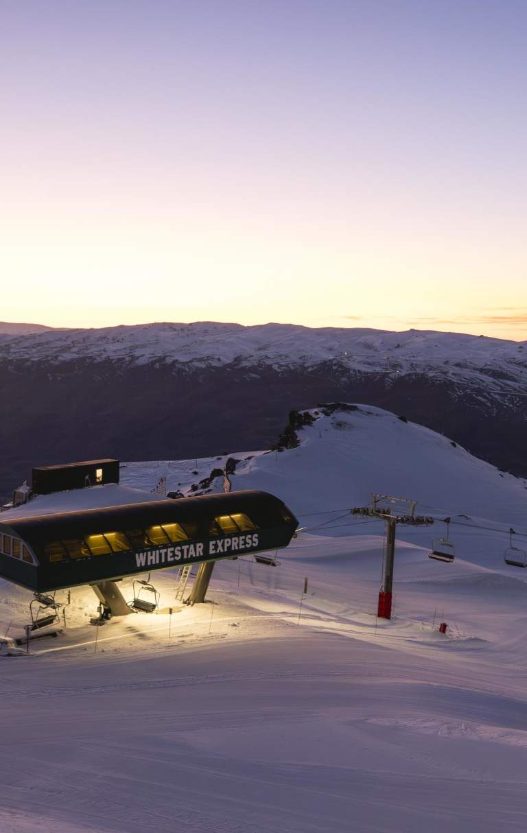 Chairlift on ski field at sunrise