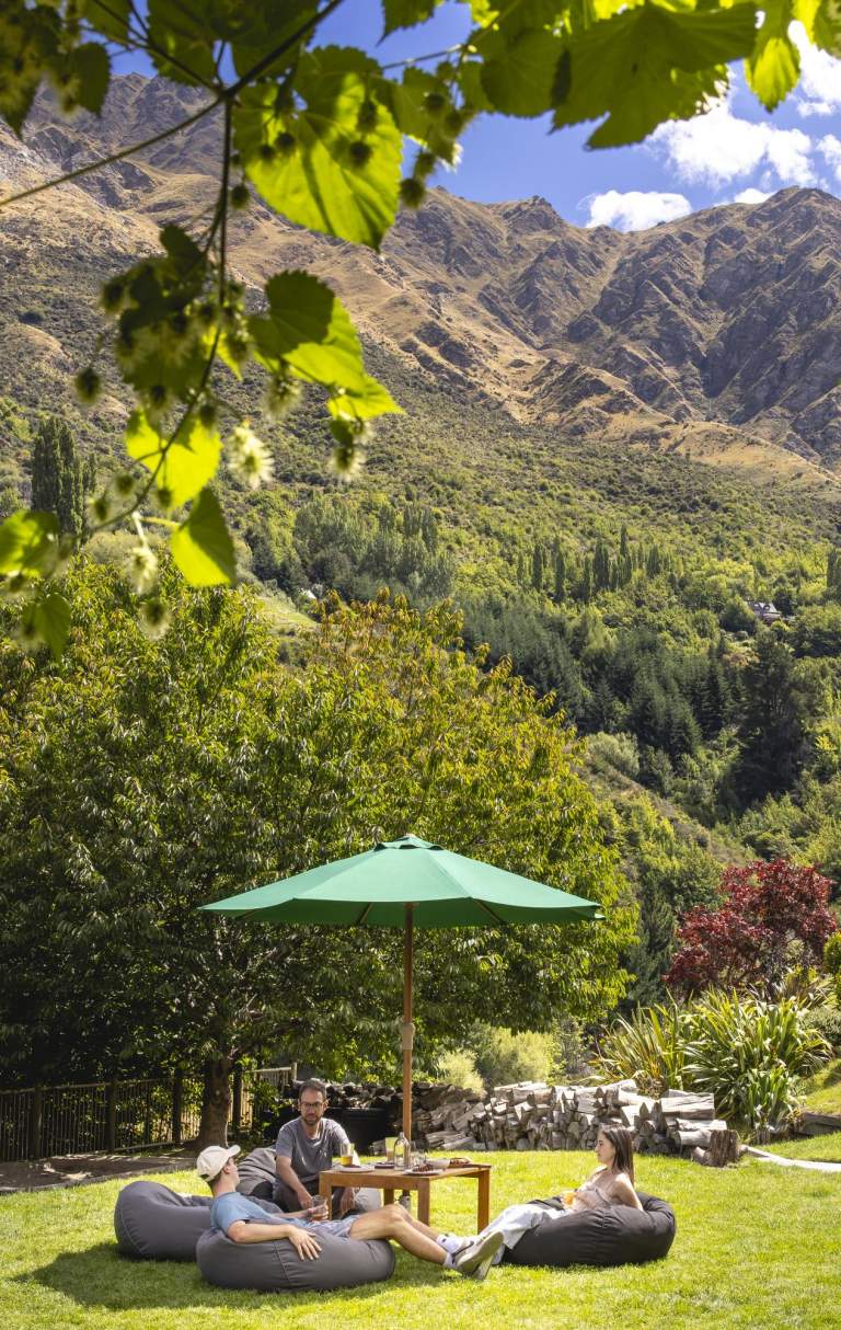 People relaxing in outdoor beer garden at Canyon Brewing