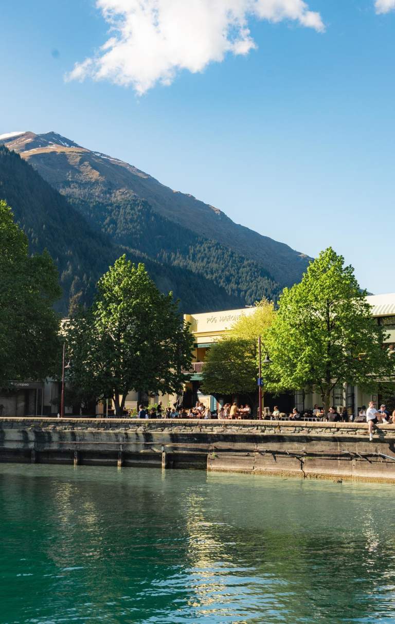 View from the lake looking at Queenstown Bay and busy waterfront